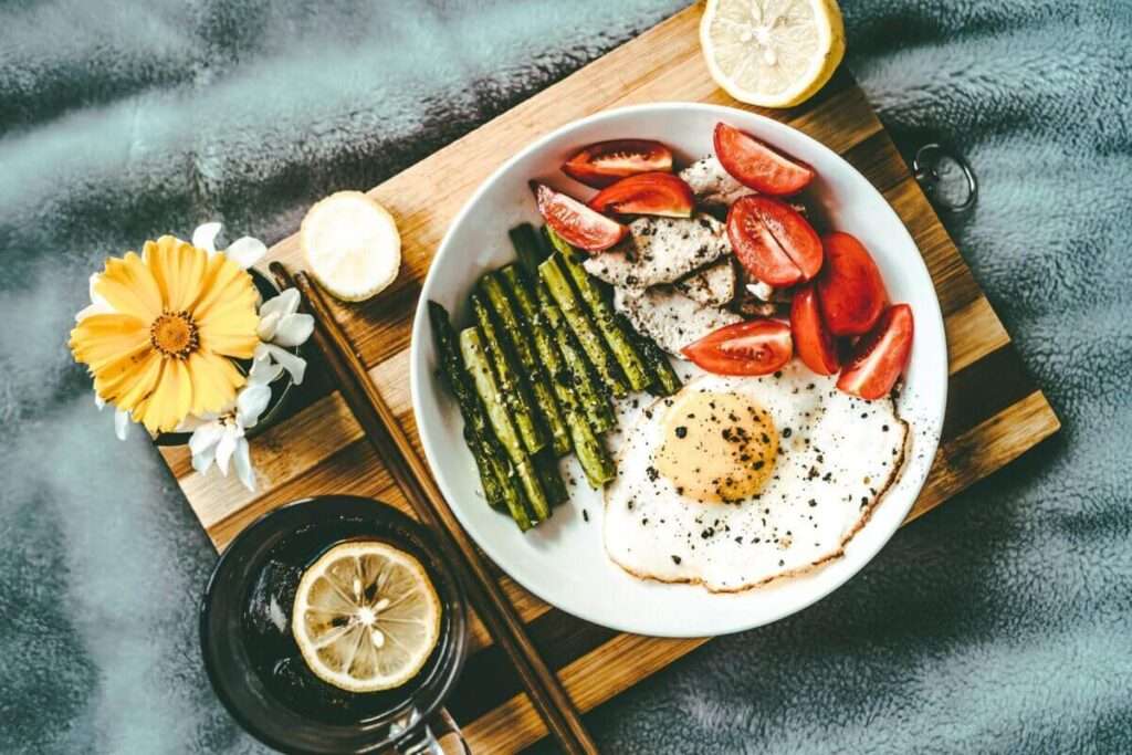 Asparagus, egg, chicken and tomato dish