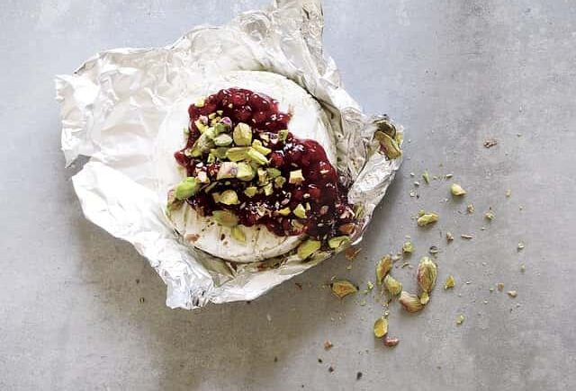 Camembert top up with cranberry jelly and pistachio