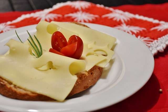 Emmental cheese on toast with tomato