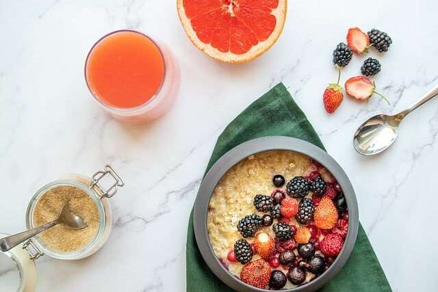 grapefruit and juice with breakfast porridge