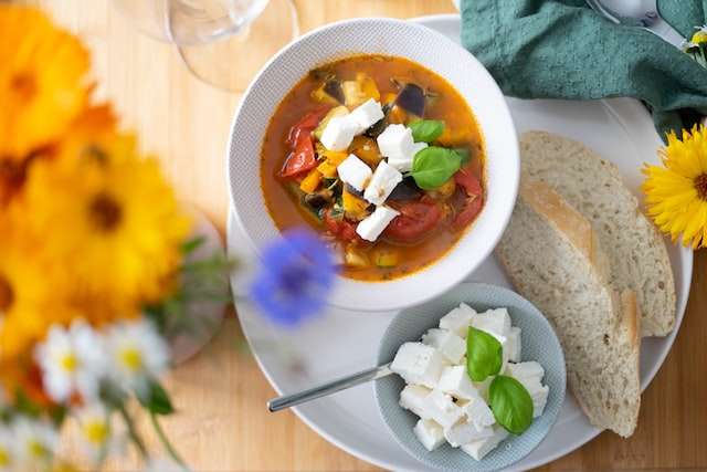 feta cheese in roast vegetables stew with toast