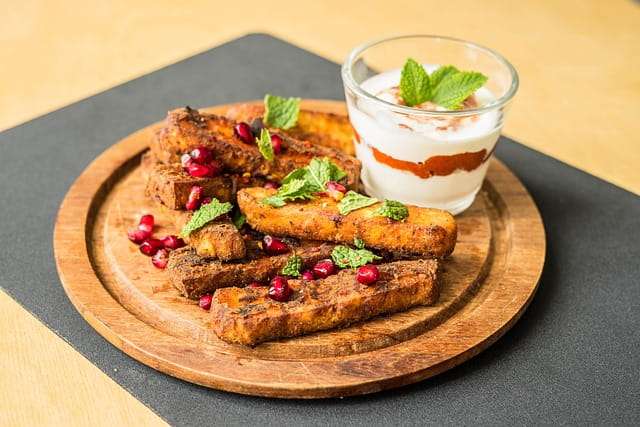 spice coated Halloumi, pomegranate seeds, mint and yoghurt delight