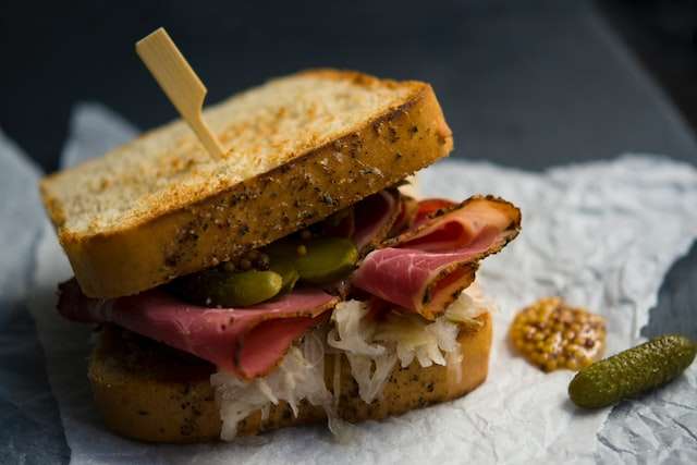 Wholegrain mustard, pastrami and pickled gherkins sandwich