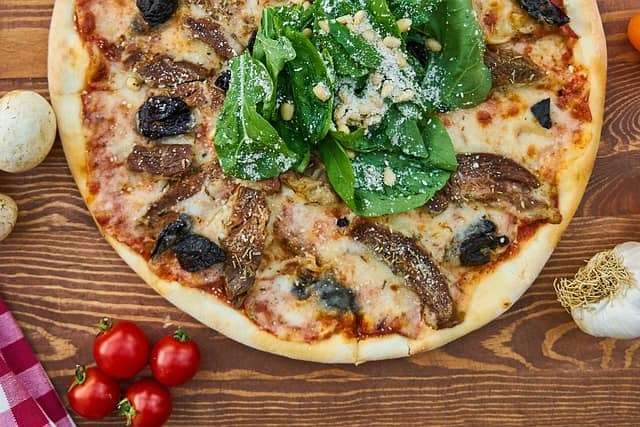 mushroom, olives, spinach and cheese pizza