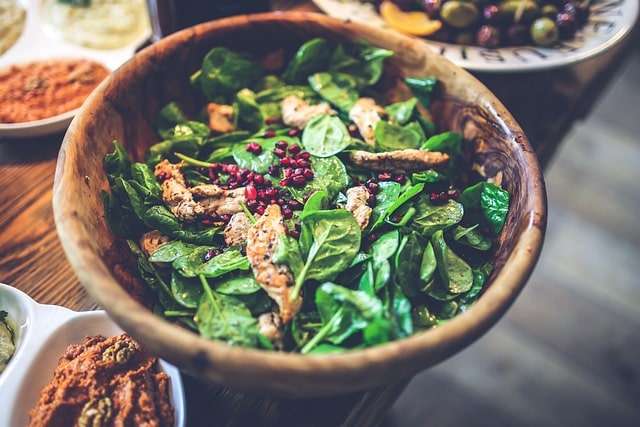 Pomegranate, chicken and baby spinach salad