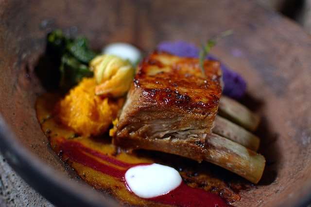 pork short ribs with carrots pure and vegetables dish