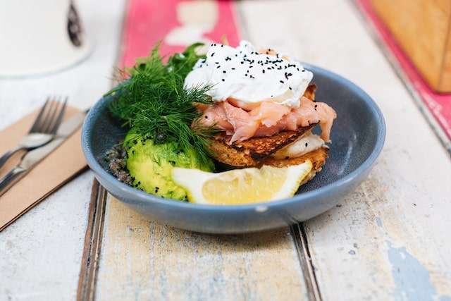 Smoked Salmon, avocado and poached egg on toasted muffin.
