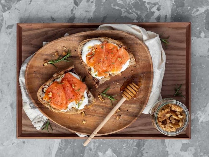 Smoked salmon, spread cheese and honey on toast
