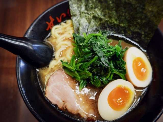 Ramen dish with pork, spinach and eggs