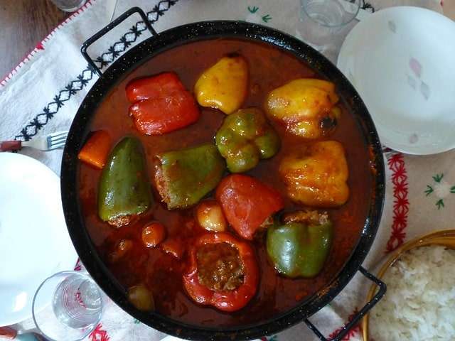 stuffed bell peppers with meat and cooked in tomato sauce