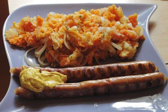 Turnip and carrots mash with sausages and mustard sauce